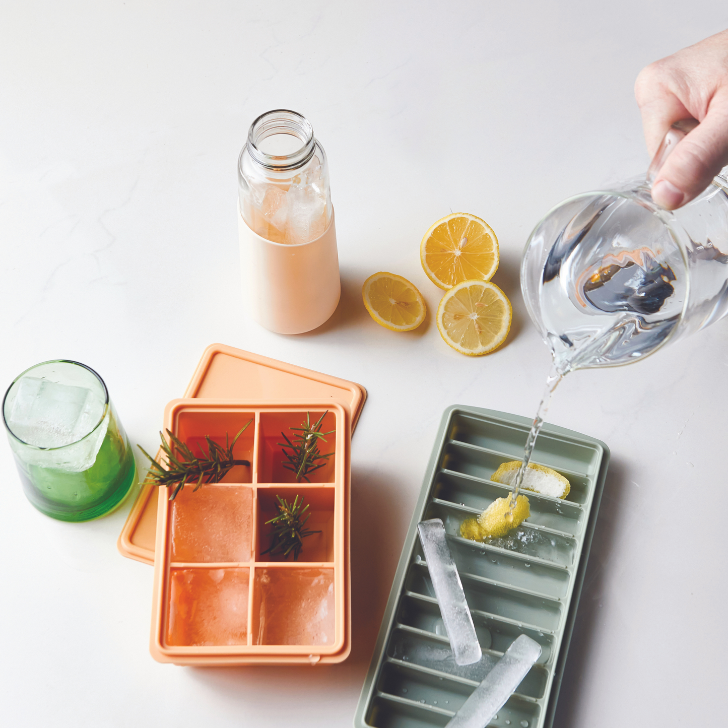 tumbler next to ice cube trays