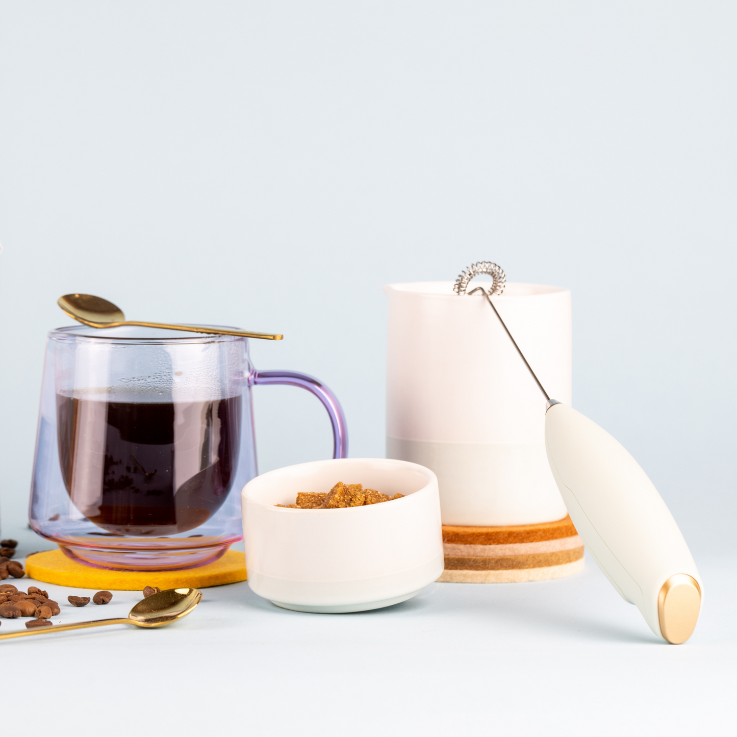 coasters with a cream set and a cup of coffee