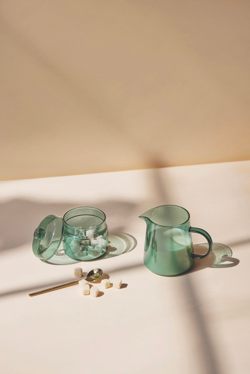 dark teal glass pitcher and jar