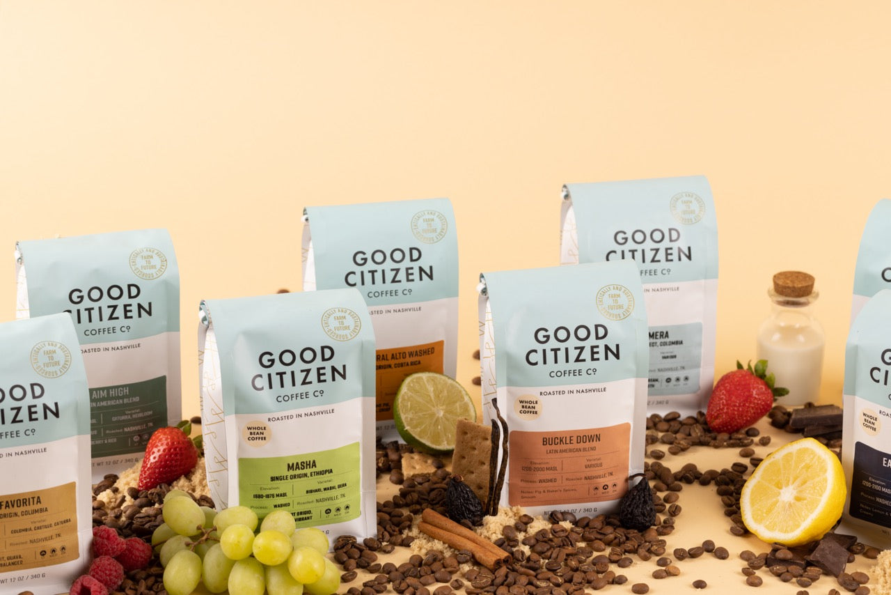 bags of coffee surrounded by beans