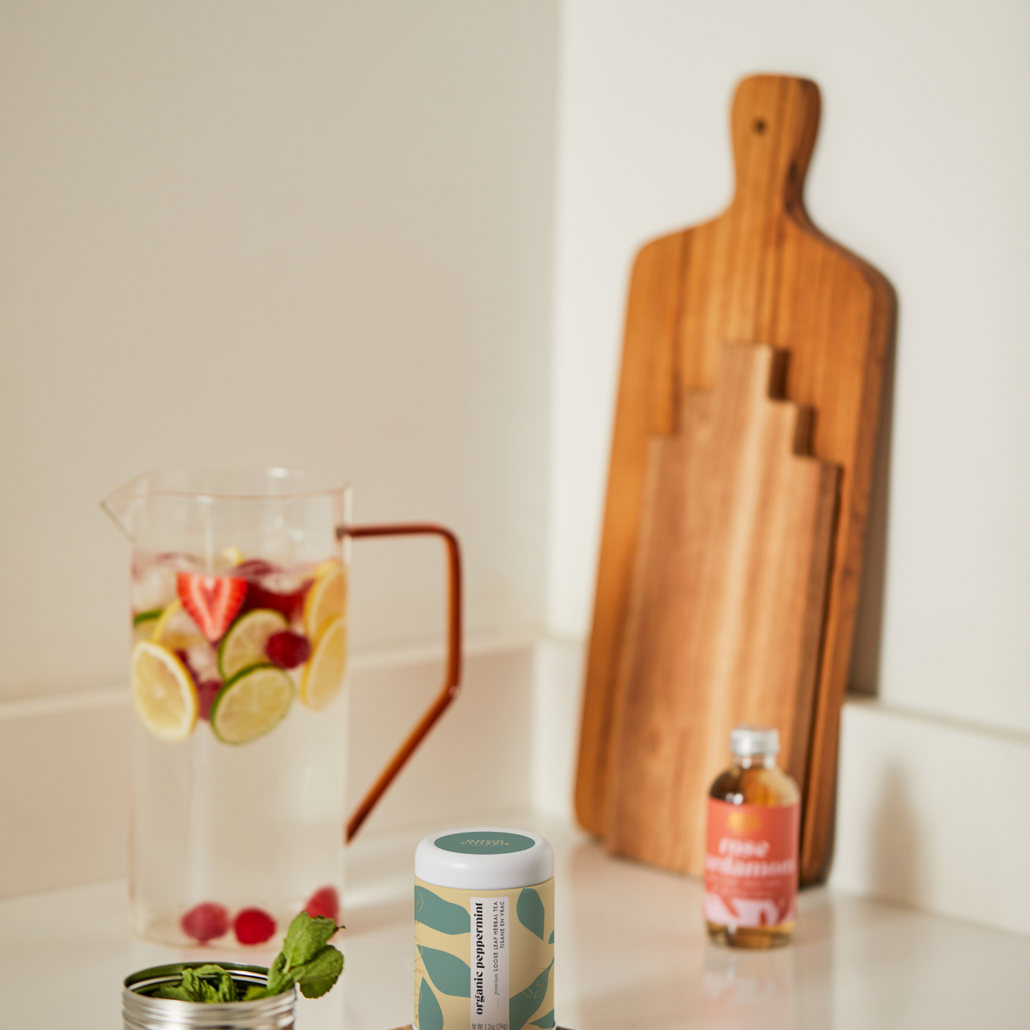 a pitcher of tea next to tea