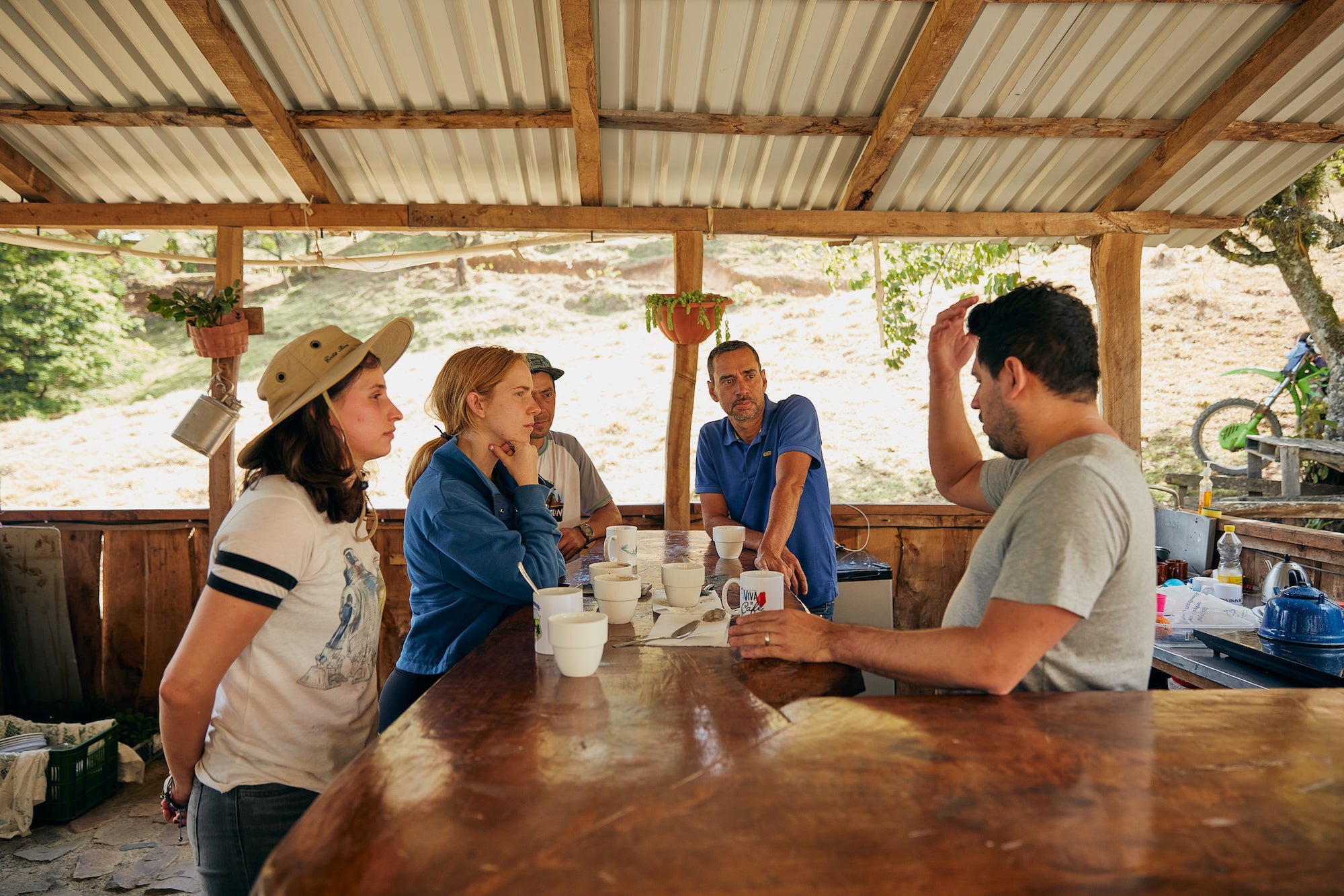 group of people learning about coffee beans