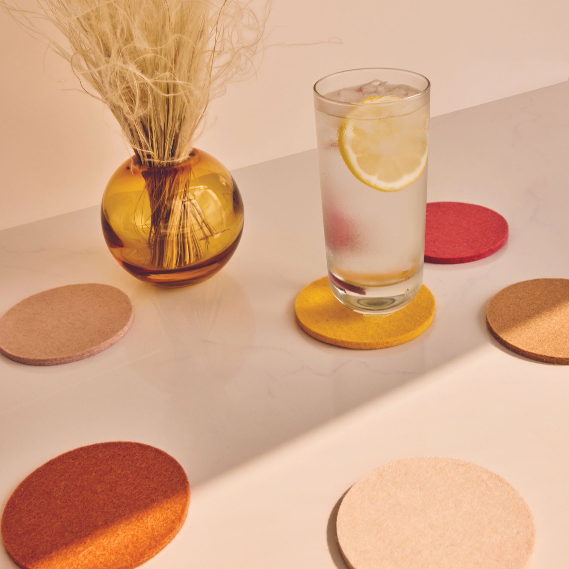 coasters with a drink on one of them