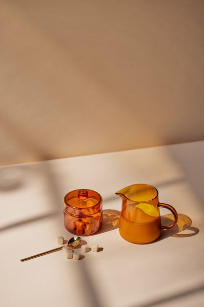 amber colored pitcher and jar