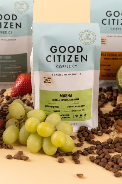 bag of coffee with grapes and coffee beans