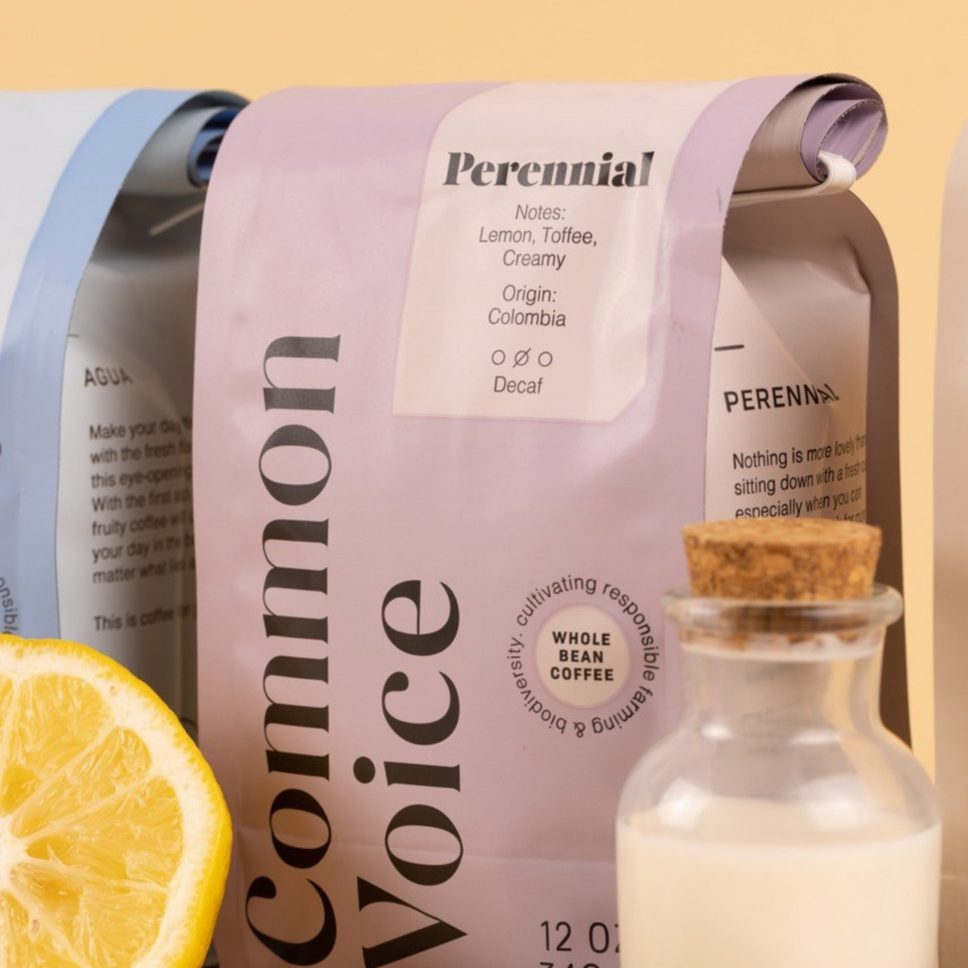 Perennial coffee bag next to agua coffee bag